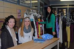 Shauni Sorge, Kelsi Wikston and Amanda Volpatti setup the donated formal dresses on sale to help fundraise for this years Prom.
